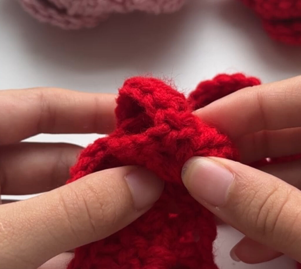 Beginning of rolling petal for crochet roses